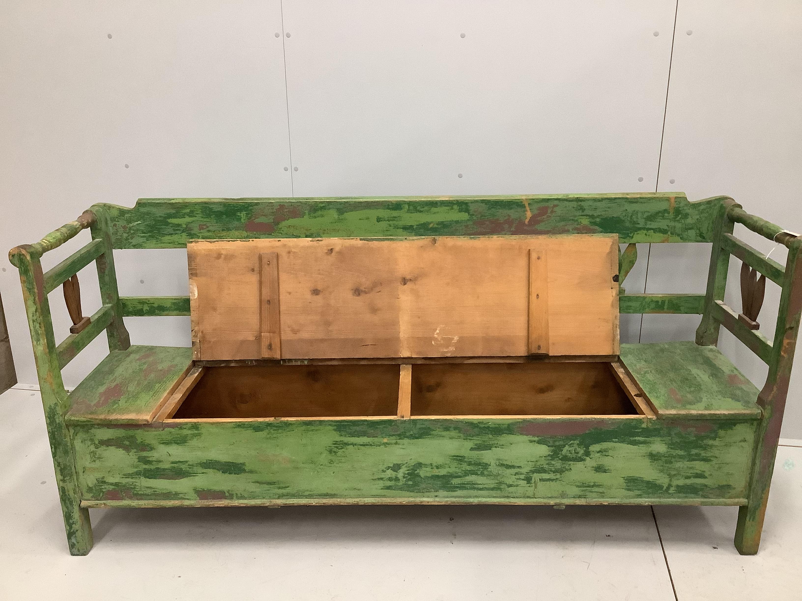 A 19th century Eastern European painted pine box seat settle, length 190cm, width 46cm, height 90cm